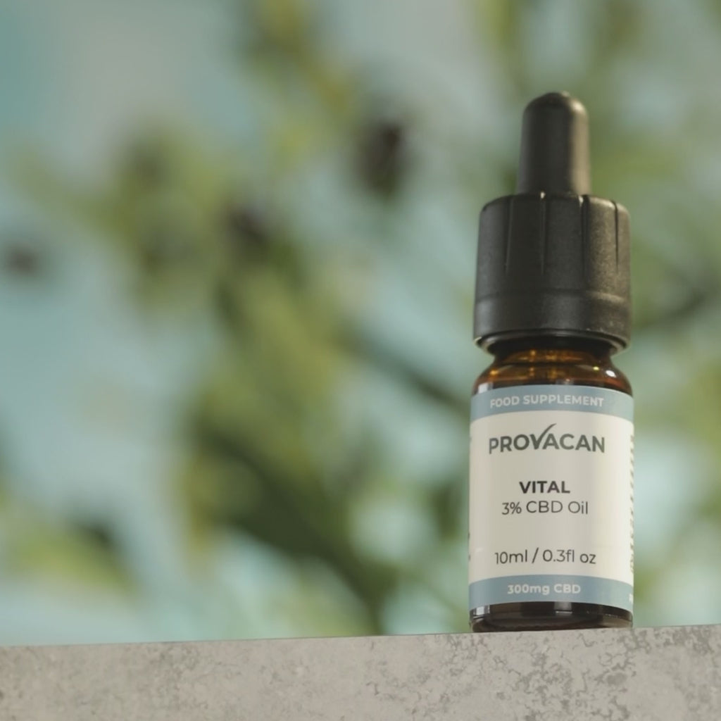 Video of Provacan Vital Oil panning on screen with soft greenery in the background. The next shot shows a full oil dropper releasing a drop of oil on a glass disk.